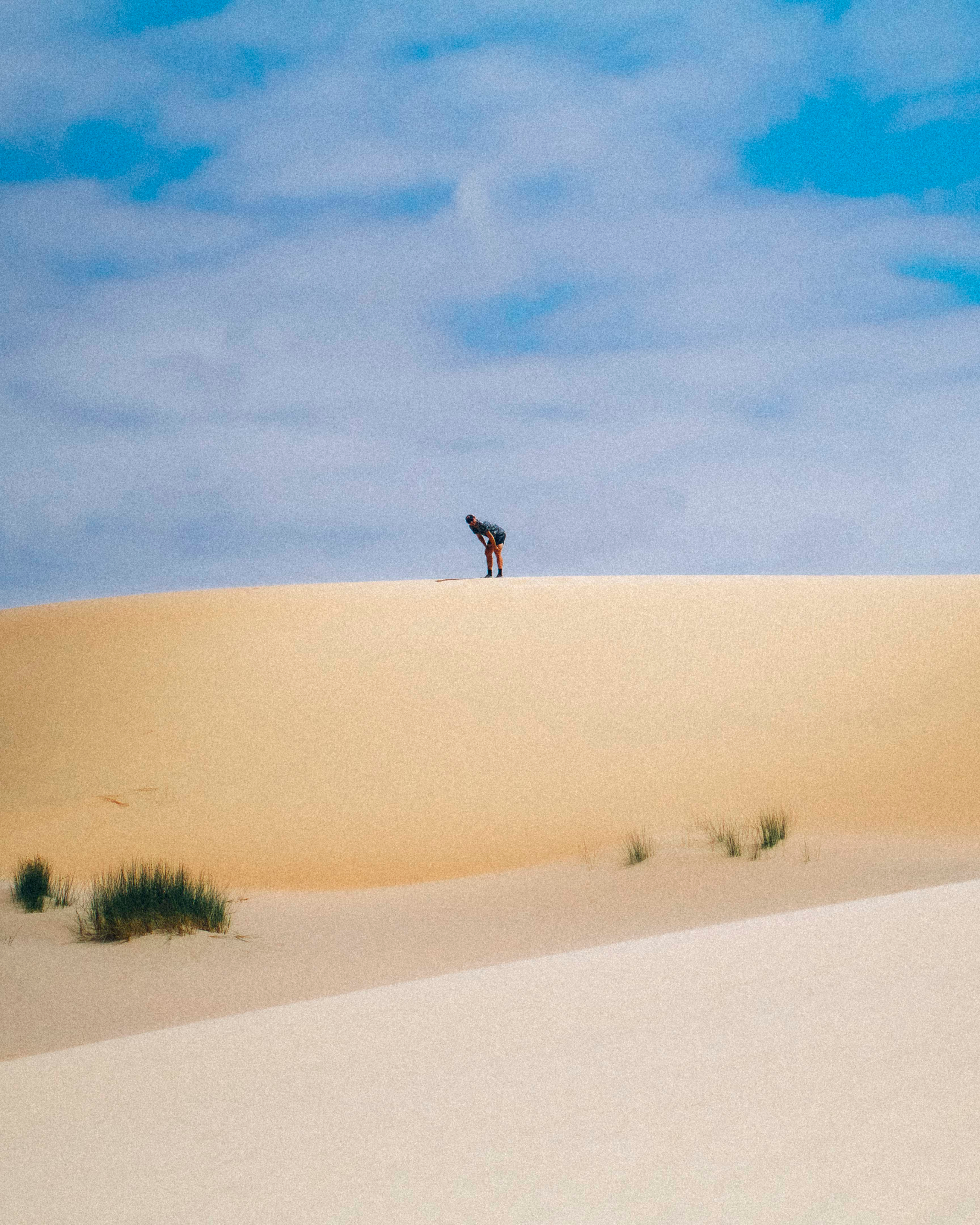Woman with sunglasses walking down runway